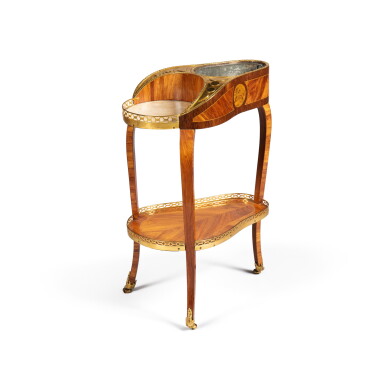 View full screen - View 1 of Lot 39. A Louis XVI gilt-bronze mounted tulipwood, amaranth, holly and maple veneered table rafraichissoir, circa 1770, stamped by Nicolas Petit | Table rafraîchissoir en placage de bois de rose, amarante, érable, houx et bronze doré d'époque Louis XVI, vers 1770, estampille de Nicolas Petit.