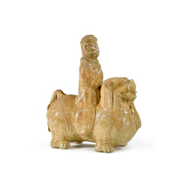 View full screen - View 1 of Lot 126. A straw-glazed 'mythical animal and rider' group, Six Dynasties | 六朝 米黃釉騎獅像.