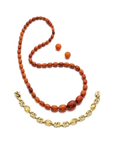 View full screen - View 1 of Lot 1151. Citrine bracelet, circa 1950 and an amber demi-parure.