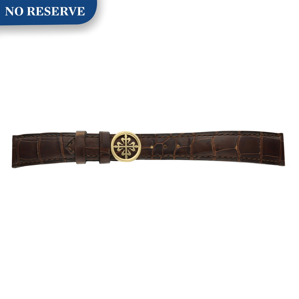 View full screen - View 1 of Lot 70. A strap with yellow gold folding buckle .