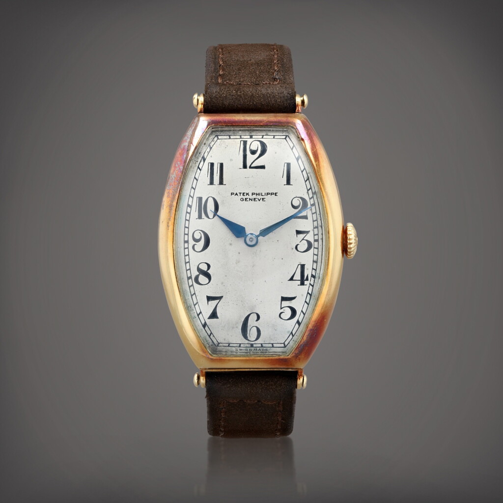 View full screen - View 1 of Lot 604. Montre bracelet tonneau en or jaune | Yellow gold tonneau-shaped wristwatch Vers 1920 | Circa 1920.