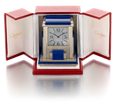 View full screen - View 1 of Lot 181. CARTIER | MYSTERY PRISM DESK TIMEPIECE SILVER-PLATED AND SIMILI-LAPIS LAZULI CLOCK (OROLOGIO DA TAVOLO IN SIMIL-LAPISLAZZULI E PLACCATO ARGENTO).