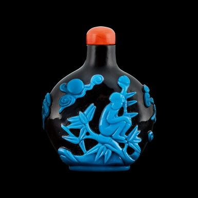 View full screen - View 1 of Lot 1048. A turquoise-blue overlay purple glass 'monkey and peach' snuff bottle Qing dynasty, 18th - 19th century | 清十八至十九世紀 黑地套藍料靈猴獻壽鼻煙壺.