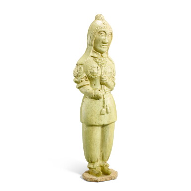 View full screen - View 1 of Lot 552. A yellow-glazed pottery warrior, Sui - Tang dynasty 隋至唐 黃釉士兵立俑.