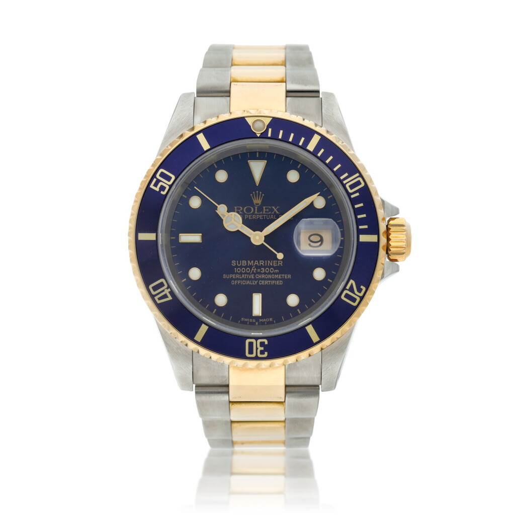 View full screen - View 1 of Lot 10. Reference 16613 Submariner A yellow gold and stainless steel wristwatch with date and bracelet, Circa 2002 .