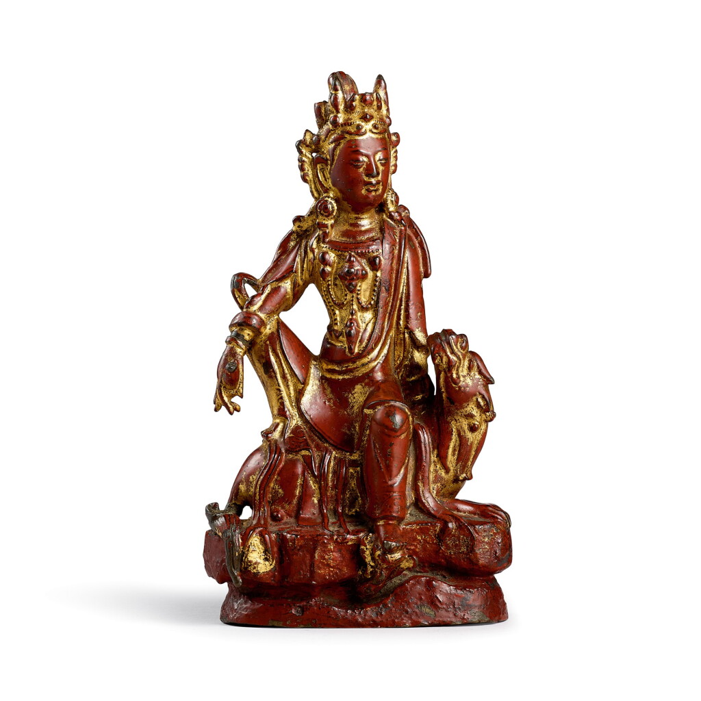 View full screen - View 1 of Lot 3675. A gilt-red lacquer bronze figure of Guanyin Yuan – Early Ming dynasty | 元至明初 銅漆金觀音菩薩坐像.
