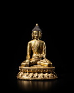 A large gilt-copper alloy figure of Shakyamuni Buddha, Tibet, 14th / 15th century