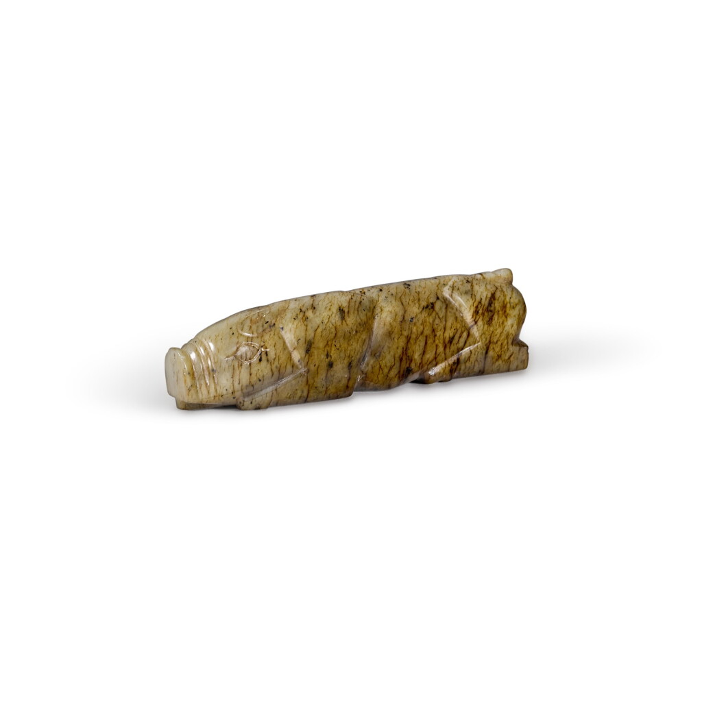 View full screen - View 1 of Lot 11. A mottled greyish-celadon jade pig Han dynasty or later | 漢或以後 青玉握豬.