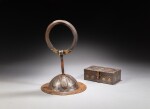 A gilt-damascened iron 'lotus' door pull and box, Tibet, circa 18th century | 西藏 約十八世紀 鐵鋄金蓮紋門把手及蓋盒一組兩件