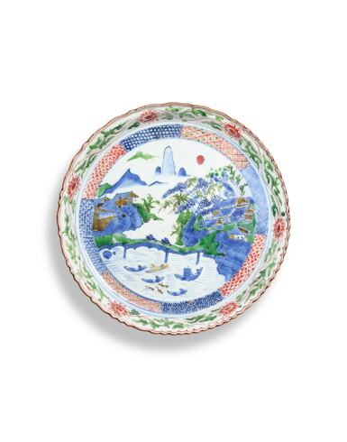 View full screen - View 1 of Lot 5163. A wucai 'landscape' Ko-sometsuke foliate dish, Ming dynasty | 明 五彩山水圖菱口盤.