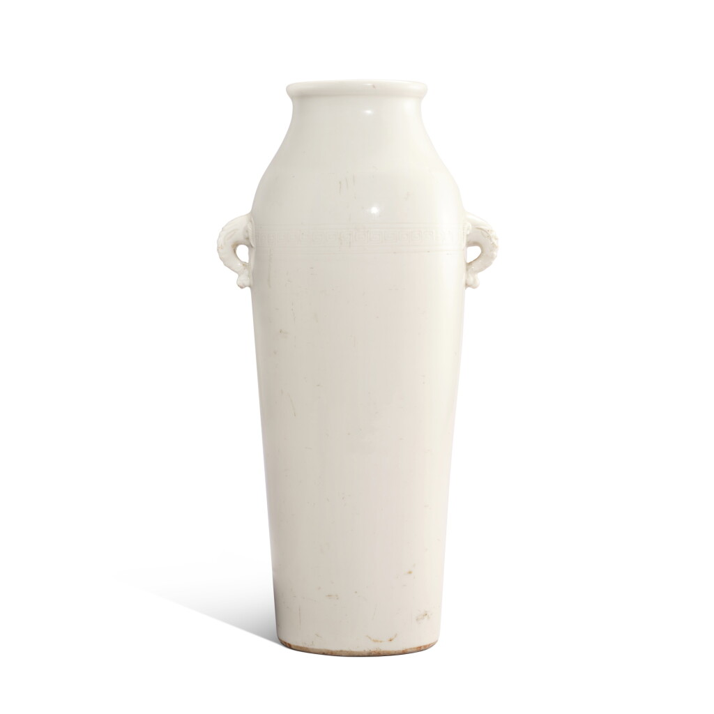View full screen - View 1 of Lot 3404. A blanc-de-Chine 'elephant' vase, Qing dynasty, 17th - 18th century | 清十七至十八世紀 德化白釉回紋象首耳瓶.