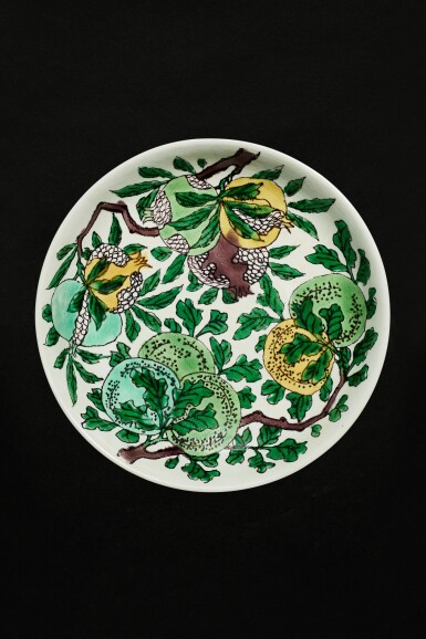 View full screen - View 1 of Lot 113. A fine biscuit-enamelled sancai dish, Mark and period of Kangxi | 清康熙 白地素三彩暗龍瑞果紋盤 《大清康熙年製》款.