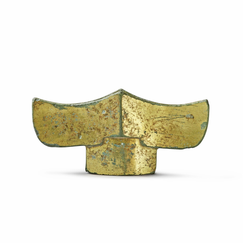 View full screen - View 1 of Lot 147. A gilt-bronze sword guard, Han dynasty | 漢 銅鎏金劍格.