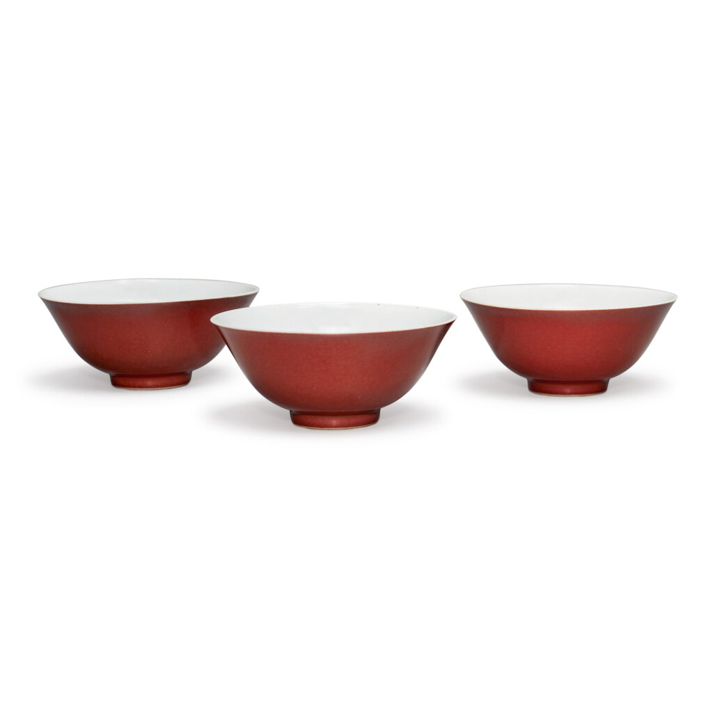 View full screen - View 1 of Lot 543. THREE COPPER-RED GLAZED BOWLS, QIANLONG SEAL MARKS AND PERIOD.