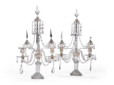 View full screen - View 1 of Lot 47. A pair of George III cut glass two branch candelabra, late 18th century, in the manner of William Parker.