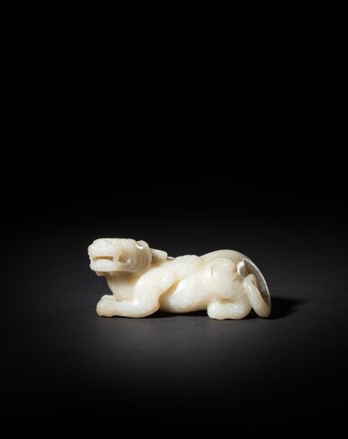 View full screen - View 1 of Lot 180. A pale celadon jade carving of a bixie, Probably Ming dynasty | 或明 青玉辟邪.