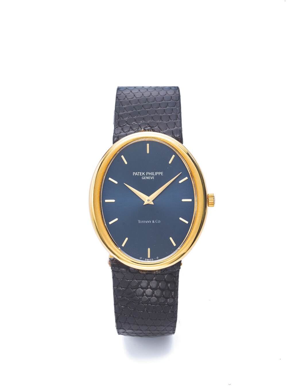 View full screen - View 1 of Lot 46. PATEK PHILIPPE | REF 3598, RETAILED BY TIFFANY & CO: A YELLOW GOLD OVAL WRISTWATCH MADE IN 1974.