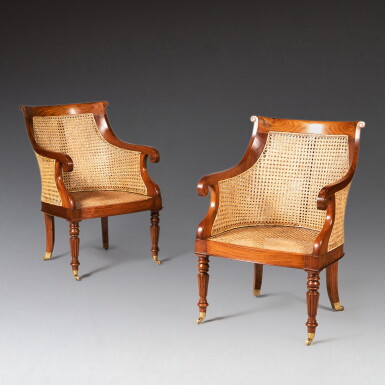 View full screen - View 1 of Lot 122. A pair of Regency style caned teak library armchairs, circa 2000 | Paire de bergères cannées en teck de style Regency, vers 2000.