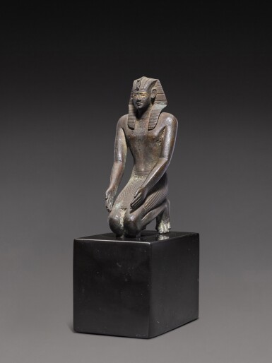 View full screen - View 1 of Lot 29. An Egyptian Bronze Figure of a King, 2nd half of the 26th Dynasty, circa 600-525 B.C..