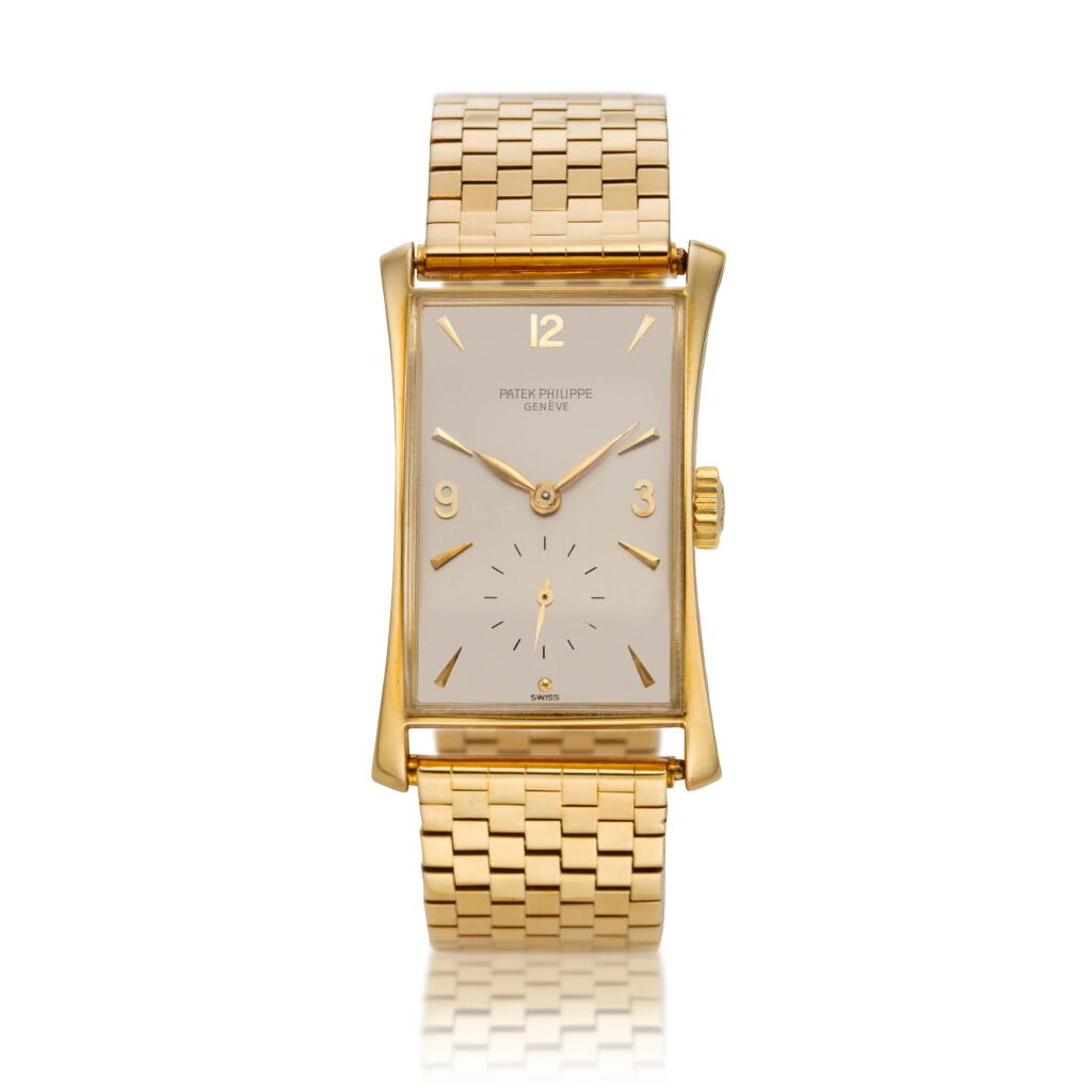 View full screen - View 1 of Lot 248. Reference 1593 'Hour Glass' A yellow gold rectangular wristwatch with bracelet, Made in 1949.