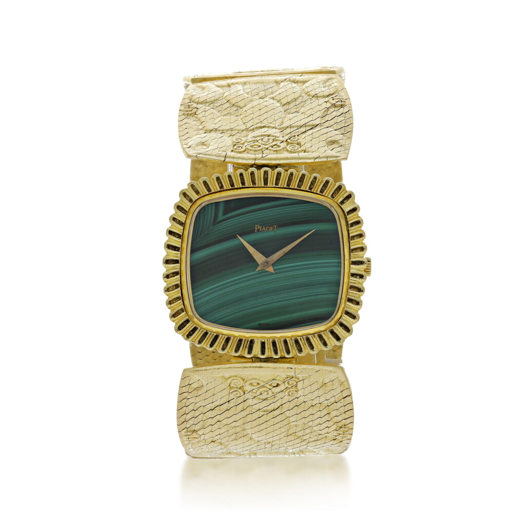 View full screen - View 1 of Lot 66. PIAGET | REFERENCE 9431 B72 A YELLOW GOLD CUSHION SHAPED BRACELET WATCH WITH MALACHITE DIAL, CIRCA 1971.