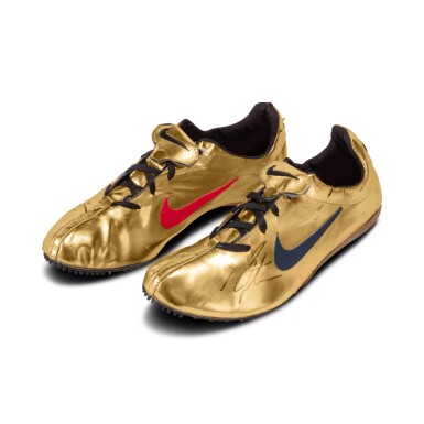 View full screen - View 1 of Lot 4. Michael Johnson Worn and Dual Signed Nike “Gold Shoe”.