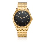 Reference 2526 A yellow gold wristwatch with a first series black enamel dial and bracelet, Made in 1954