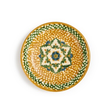 View full screen - View 1 of Lot 173. A sancai and blue-glazed pottery tripod dish, Tang dynasty | 唐 三彩加藍寶相花紋三足盤.