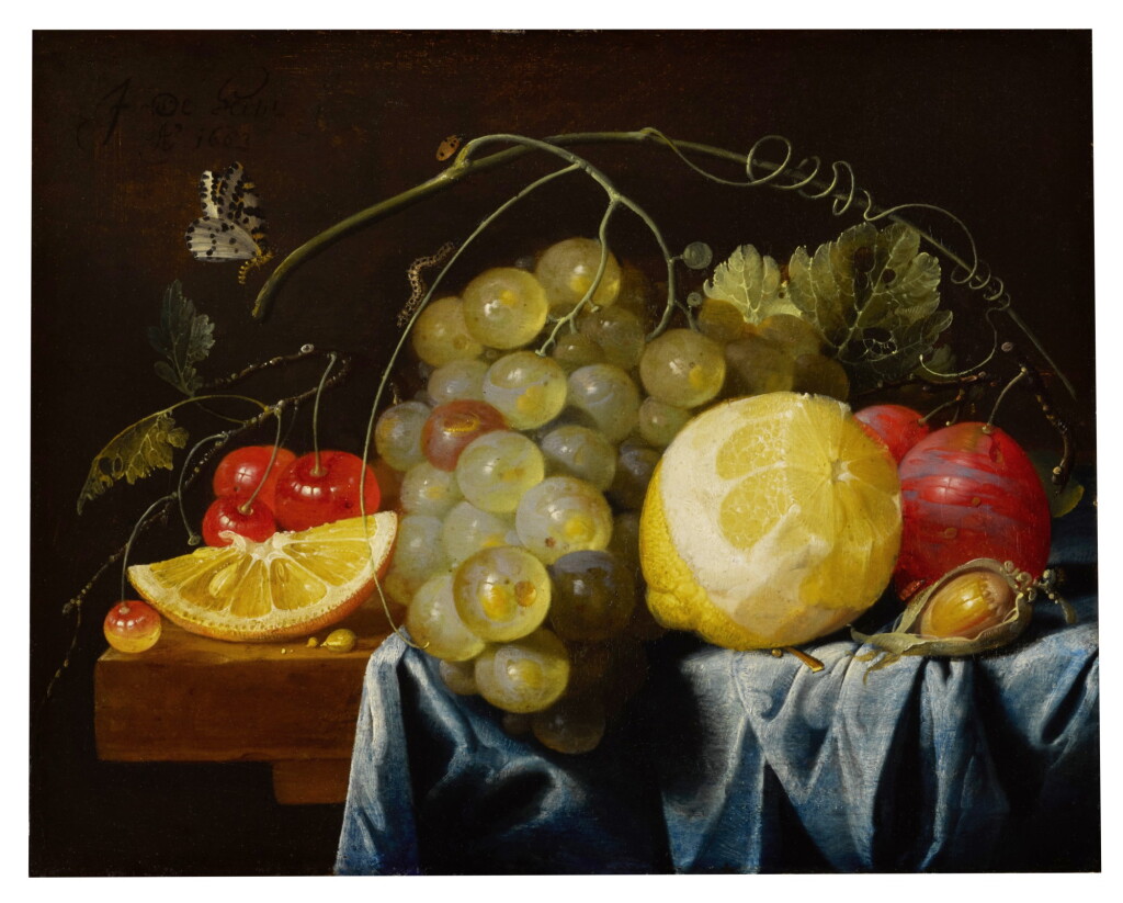 View full screen - View 1 of Lot 33. Still life of fruit, including lemons, grapes, pears and cherries, together with a hazelnut, all arranged on a table largely draped with a blue cloth | 《靜物:桌子上的檸檬、葡萄、紅梨、櫻桃及一顆榛子,藍色布覆蓋大半桌面》.