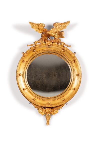 View full screen - View 1 of Lot 139. A Regency style giltwood convex mirror | Miroir bombé en bois doré de style Régence.