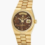 Oysterquartz Day-Date 'Pyramid', Reference 19028 | A yellow gold wristwatch with mahogany dial, day, date and bracelet | Circa 1986