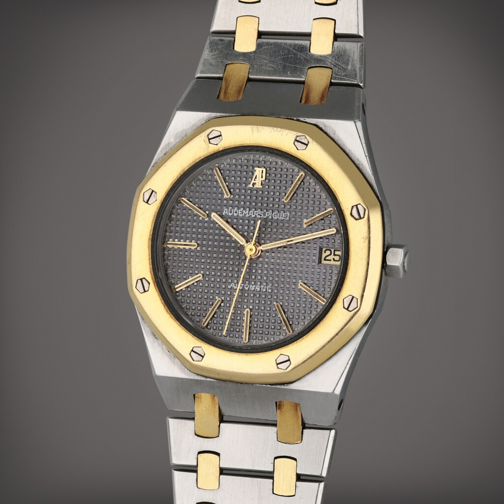 View full screen - View 1 of Lot 96. Reference 4100SA Royal Oak | A yellow gold and stainless steel automatic wristwatch with date and bracelet, Circa 1975.