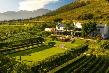 View full screen - View 1 of Lot 55. Explore the World of Fine Wine | Leeu Passant, Franschhoek, and Creation, Hemel-en-Aarde Ridge, South Africa | For 2 guests, a tasting and lunch with the owners of both Leeu Passant and Creation, and an overnight stay at one of the three Franschhoek properties in the Leeu Portfolio of luxury hotels, together with a copy of Platter’s South African Wine Guide 2026 (signed by the editor, Philip van Zyl, and associate editor, Cathy van Zyl MW) .