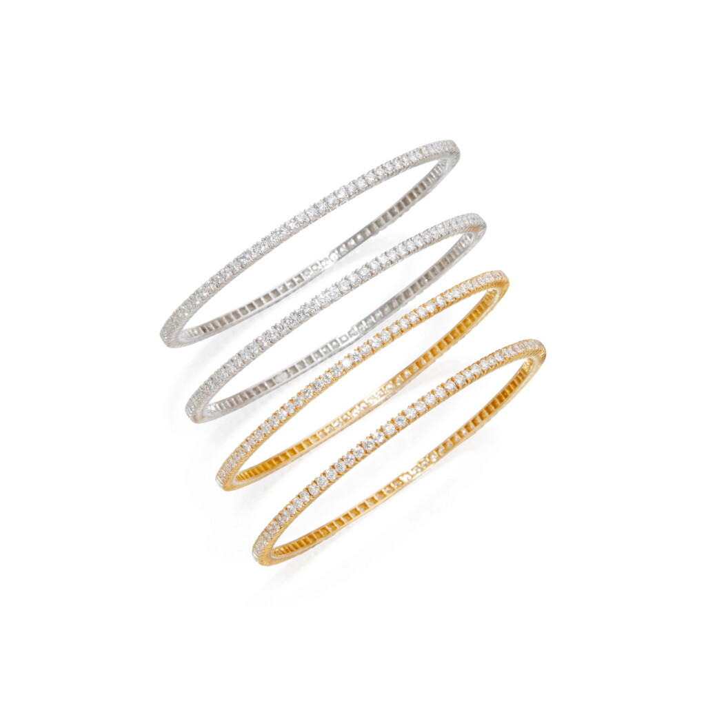 View full screen - View 1 of Lot 141. FOUR DIAMOND BANGLE-BRACELETS.