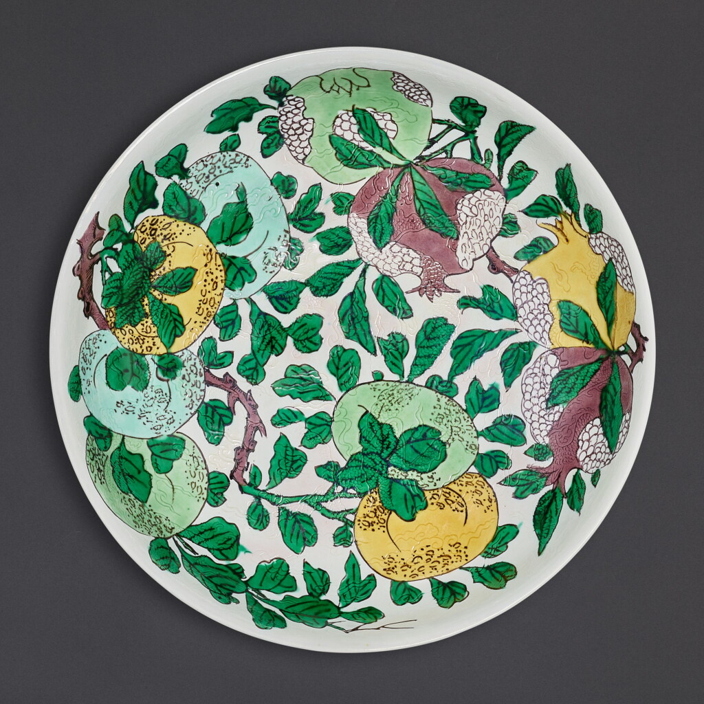 View full screen - View 1 of Lot 3510. A rare biscuit-enamelled sancai dish, Mark and period of Kangxi | 清康熙 白地素三彩暗龍瑞果紋盤 《大清康熙年製》款.