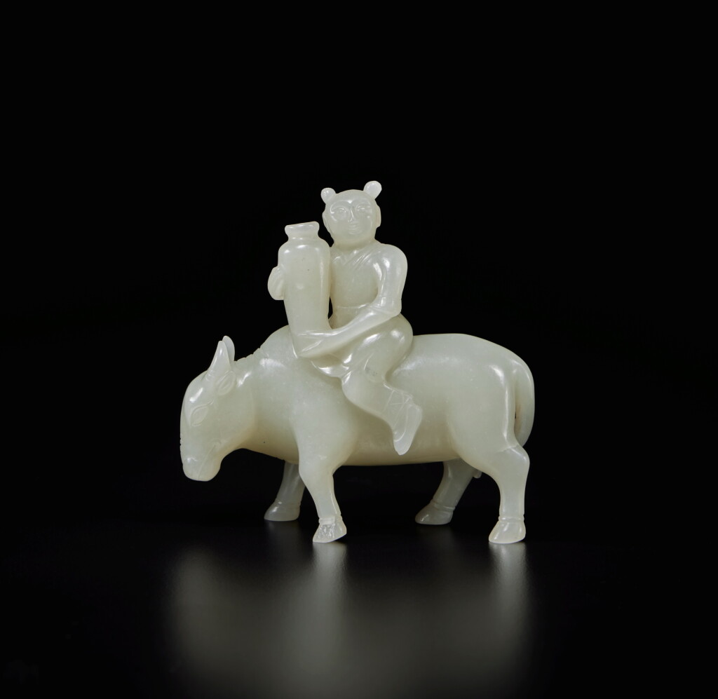 View full screen - View 1 of Lot 453. A pale green jade 'boy and buffalo' group, Qing dynasty | 清 青白玉童子牧牛擺件.