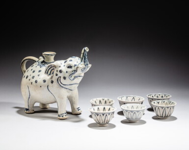 View full screen - View 1 of Lot 132. A blue and white elephant-form water dropper and six blue and white cups, Vietnam, Lê dynasty, 15th / 16th century | 越南 黎朝 十五 / 十六世紀 青花象形壺及蓮紋盃一組七件.