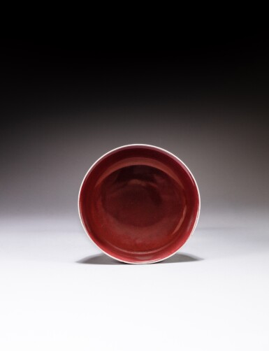View full screen - View 1 of Lot 147. A red-glazed dish, mark and period of Qianlong | 清乾隆 紅釉盤 《大清乾隆年製》款.