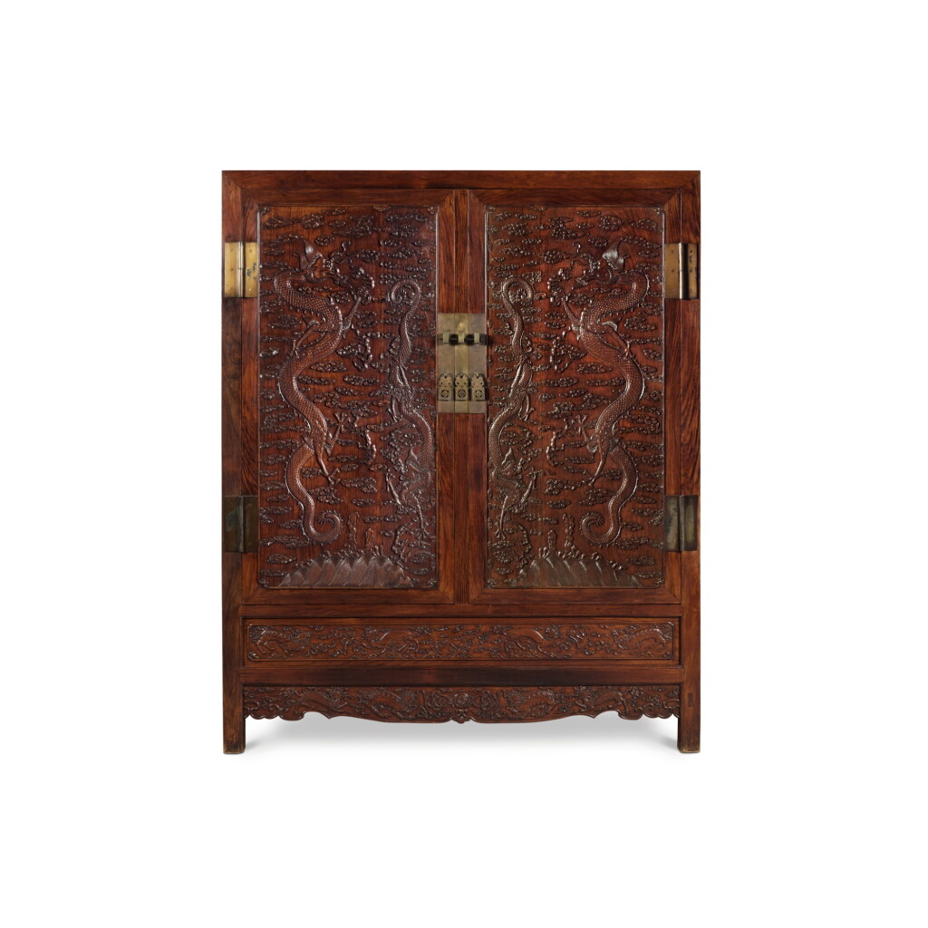 View full screen - View 1 of Lot 151. A rare carved 'Huanghuali' 'dragon' cabinet, Early Qing dynasty .