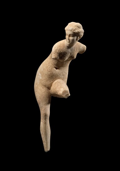 View full screen - View 1 of Lot 26. A Hellenistic Marble Figure of Aphrodite, circa 2nd/1st century B.C..
