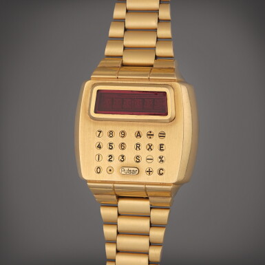 View full screen - View 1 of Lot 503. A yellow gold calculator wristwatch with bracelet, Circa 1980.