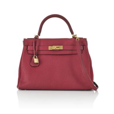 View full screen - View 1 of Lot 2. HERMÈS | ROUGE COLOUR KELLY RETOURNÉ 28 IN TOGO LEATHER WITH GOLD HARDWARE, 2017.