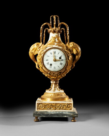View full screen - View 1 of Lot 38. A Louis XVI gilt-bronze marble clock, circa 1780, after a model designed by Brècourt in 1775 | Pendule en marbre et bronze doré d'époque Louis XVI, vers 1780, d'après un modèle réalisé en 1775 par le Bronzier Brécourt.