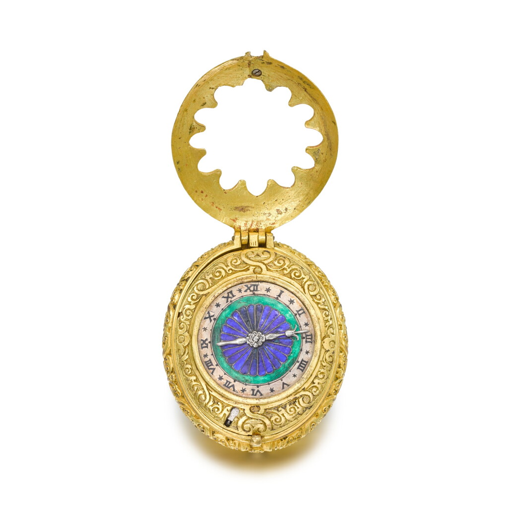 View full screen - View 1 of Lot 1302. A rare and early gilt-metal two-train clock watch with stackfreed and enamel dial Circa 1580.