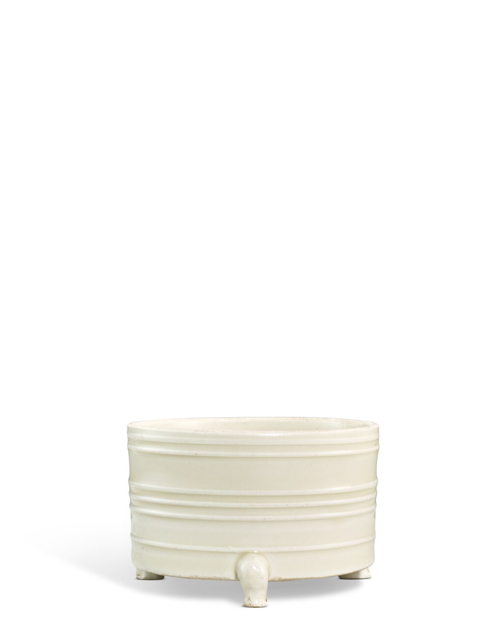 View full screen - View 1 of Lot 3669. A Dingyao ribbed cylindrical tripod incense burner, Northern Song dynasty | 北宋 定窰白釉弦紋三足奩式爐.