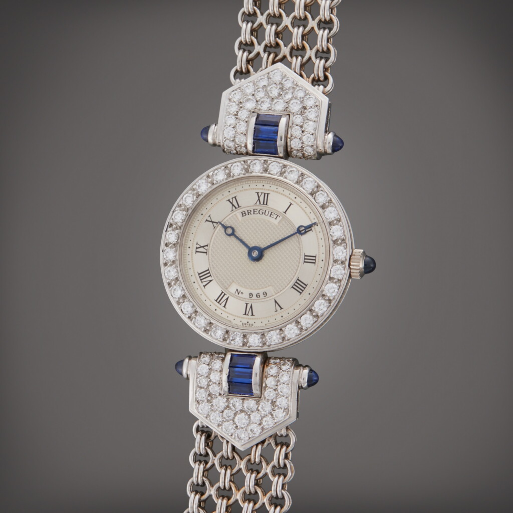 View full screen - View 1 of Lot 84. Reference 8241 | A white gold, sapphire and diamond-set wristwatch with bracelet, Circa 2000.