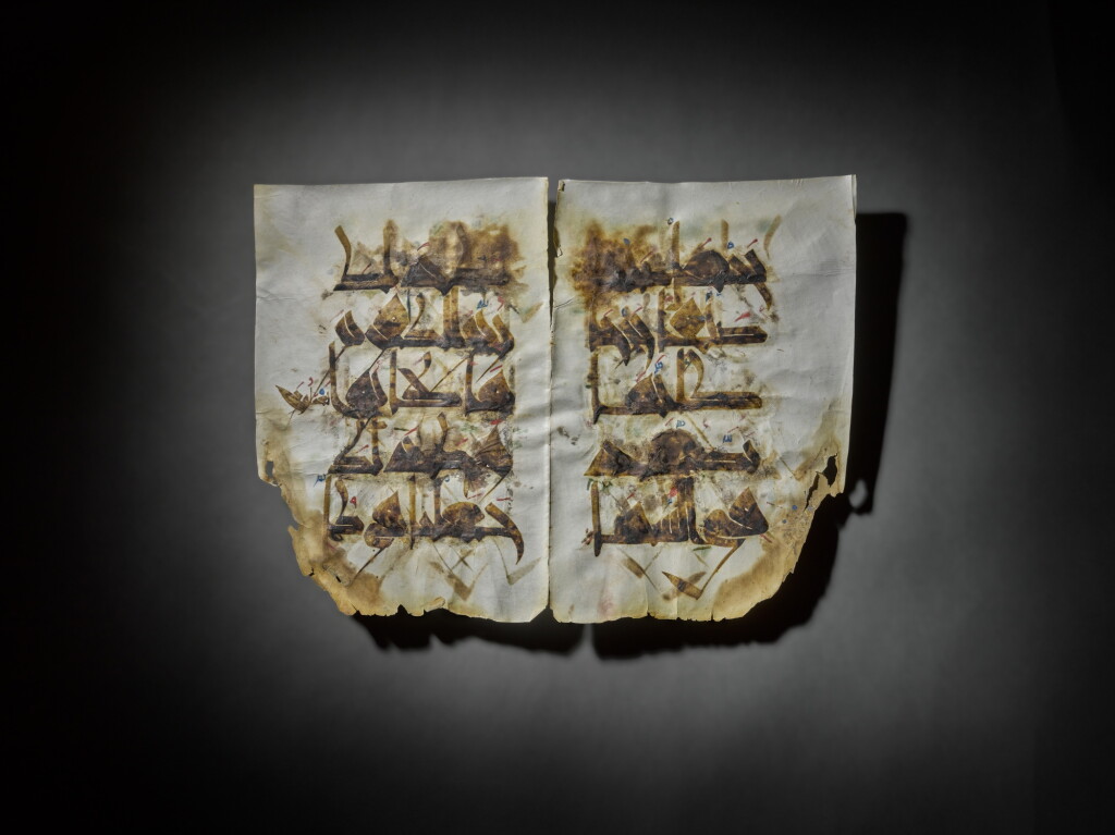 View full screen - View 1 of Lot 114. A Qur'an bifolium in Kufic script on vellum from the Mushaf Al-Hadinah, The 'Nurse's Qur'an', copied by 'Ali Al-Warraq, Qairawan, North Africa, 410 AH/1020 AD.