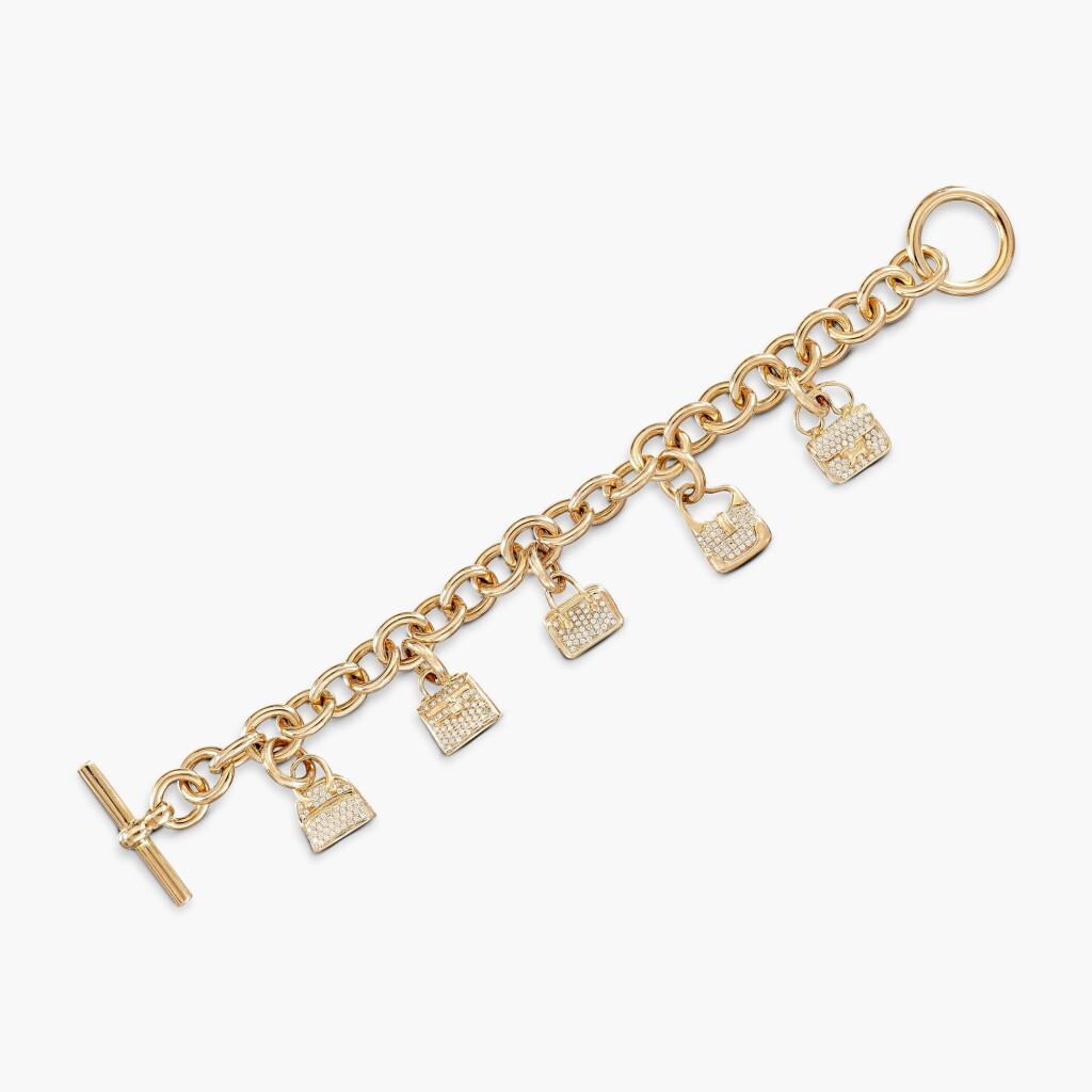 View full screen - View 1 of Lot 689. Gold and Diamond 'Amulettes' Charm Bracelet.
