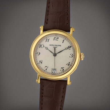 View full screen - View 1 of Lot 58. Reference 5053J-001 | A yellow gold wristwatch with date | Circa 2006.