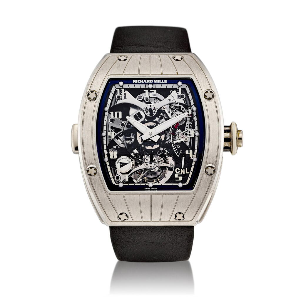 View full screen - View 1 of Lot 2082. Reference RM015 | A platinum skeletonized dual time zone tourbillon wristwatch with power reserve and torque indication, Circa 2008 | 型號 RM015 | 鉑金鏤空陀飛輪兩地時間腕錶,備動力儲備及力矩顯示,約2008年製.